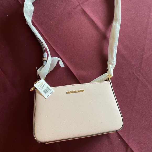 Michael Kors Handbags - Michael Kors light blush pink NWT purse.